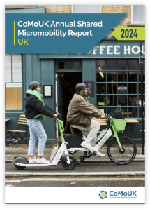 Front cover of the micromobility report 2024 with an e-scooter and e-bike being ridden past a coffee shop